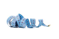 Measuring tape isolated on light background. Weight loss