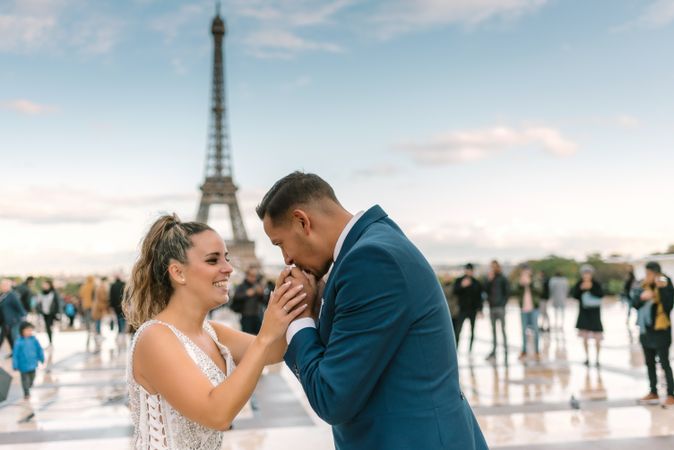 Happy newlyweds in wedding clothing kissing