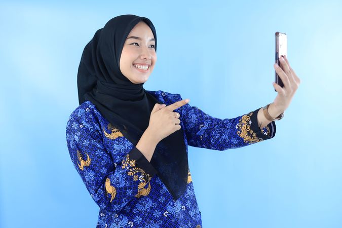 Indonesian Young Woman Video Call using Mobile Phone