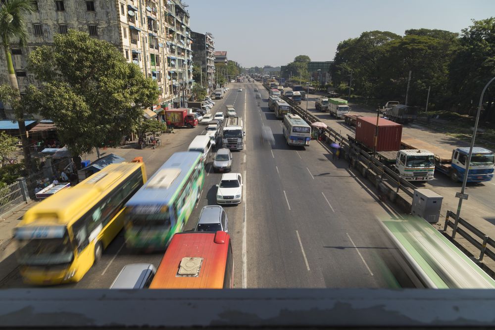 Yangon, Myanmar - December 19, 2019: Afternoon traffic in Yangon city over Strand Road