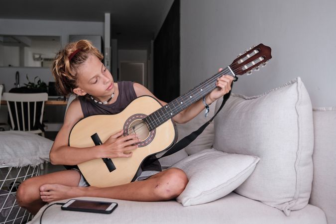 Child playing the guitar