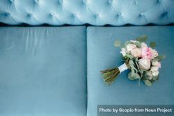 Pink flower bouquet on blue couch 5wkJW5