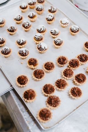Tray with pig shaped desserts in bakery