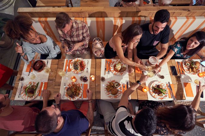 Positive multiethnic friends having dinner