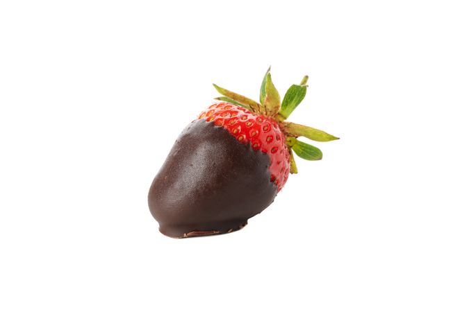 Chocolate fondue. Strawberry in chocolate isolated on plain background