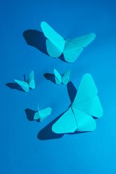 Paper butterflies on silk cloth