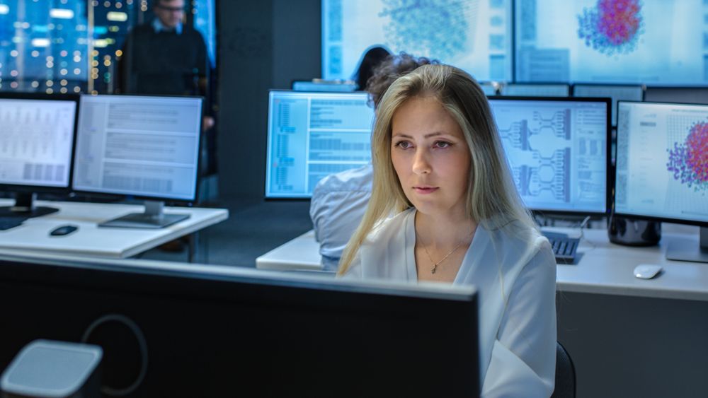 Female Computer Engineer Works on a Project Team of Specialist.