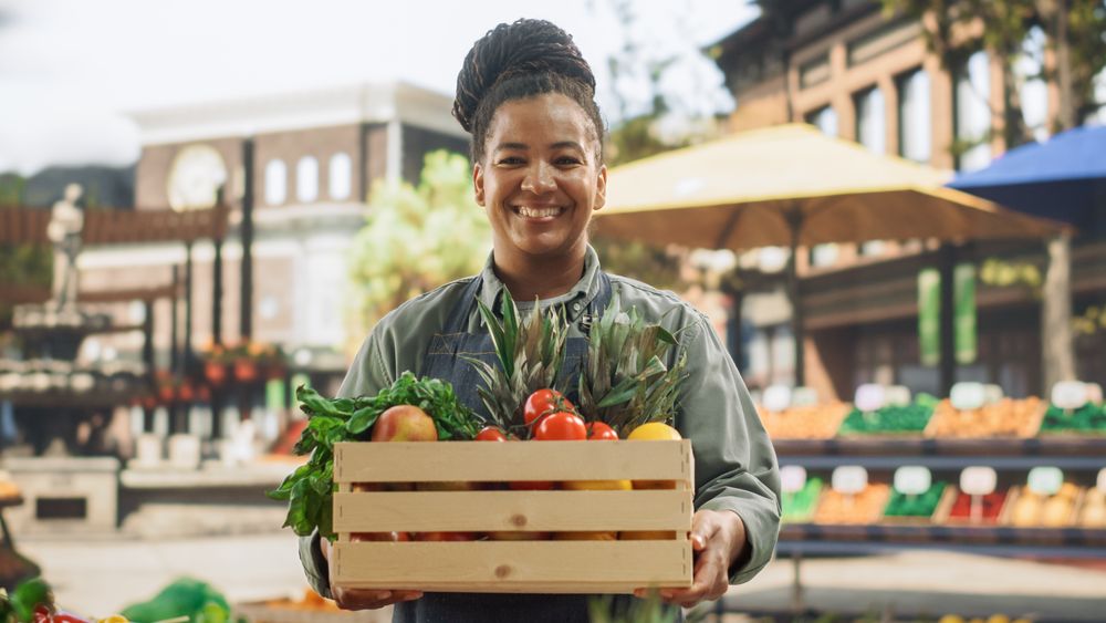 Portrait of a Multiethnic  Female Managing a Street Vendor Food Stand with Fresh Organic Agricultural Products