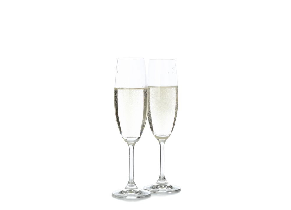 Champagne glasses isolated on light background. Celebration drink