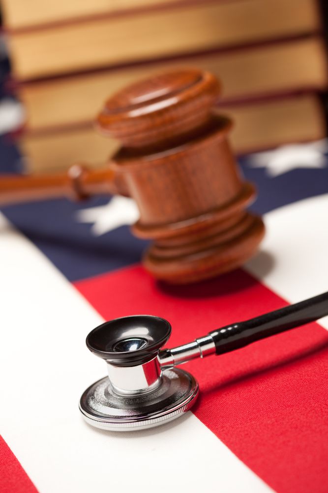 Gavel, Stethoscope and Books on Flag