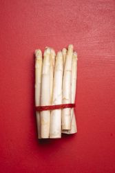 Asparagus on a red table