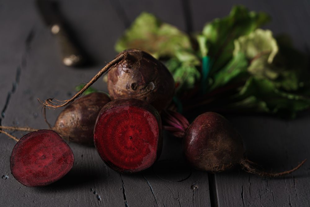 Bunch of raw beetroot with edible taproots and leaves