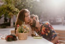 Loving couple sitting on cafe terrace