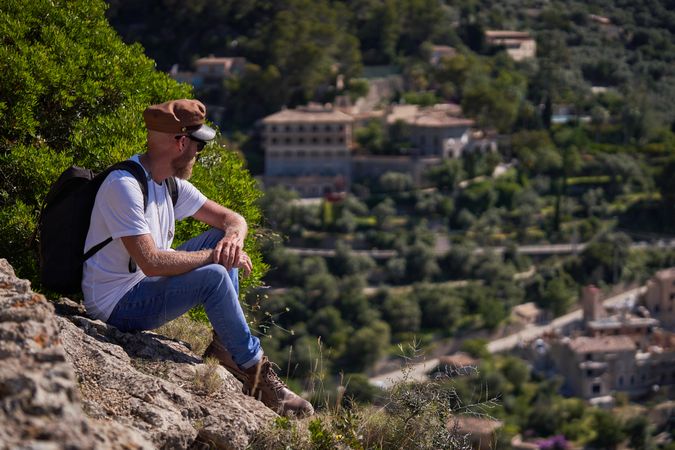 Male traveler enjoying view of mountain town
