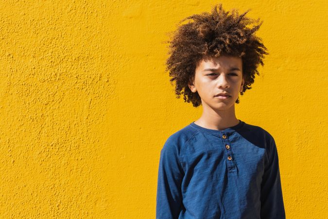 Pensive boy with Afro hairstyle
