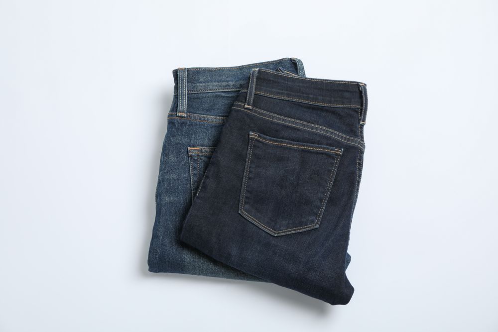 Jeans on light background, space for text