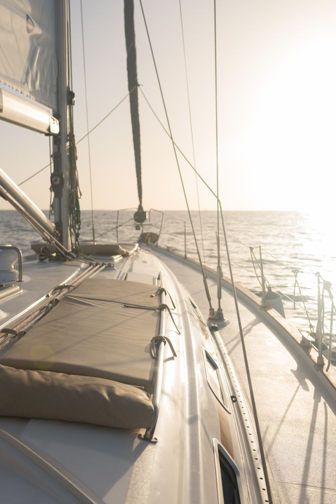 Seats on nose of yacht on water