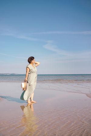 Woman gazing at sea horizon