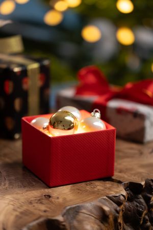 Christmas box with glowing ornaments
