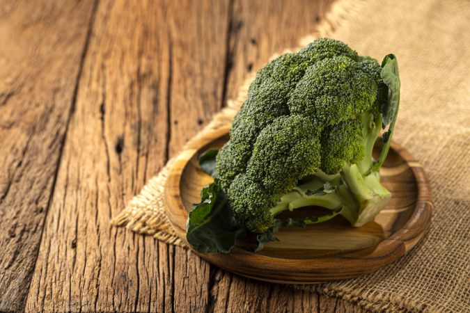 Green organic broccoli on the table.