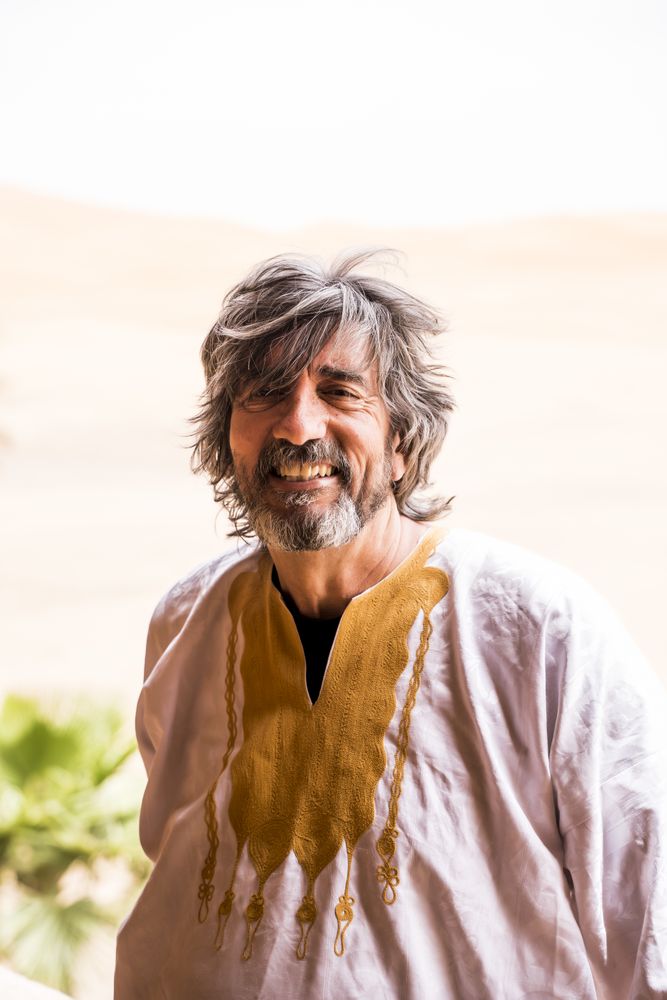Portrait of adult man in desert