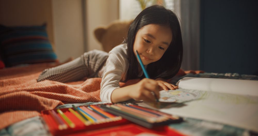 Asian Kid Playing in Her Cozy Room with Toys