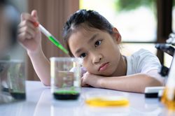 A girl doing a science experiment.