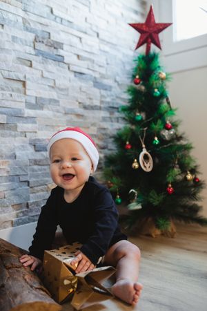 Excited baby with Christmas gift