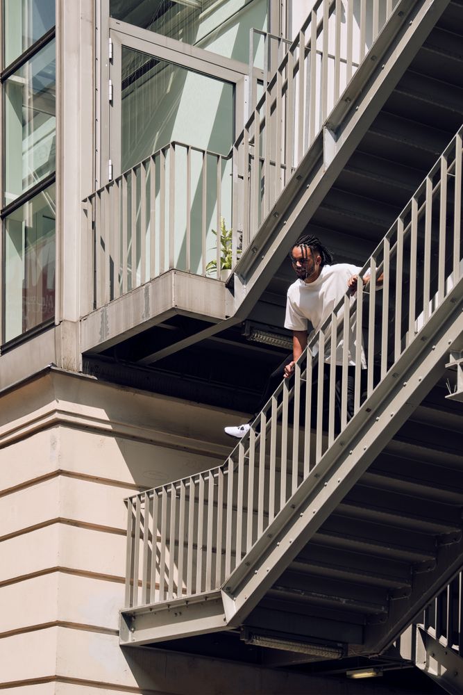 Black male standing on bridge