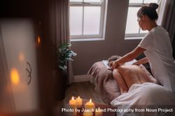 Woman receiving body massage at spa center 47mreB