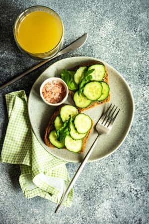 Top view of healthy lunch with vegetable cucumber toast