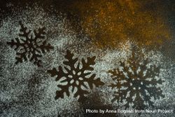Christmas card concept or snowflake shape in snow on counter 0ykYL4
