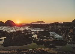 Beautiful sunset over the sea as seen from a rocky coast