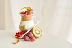 Jar with tasty yogurt desert with fruits
