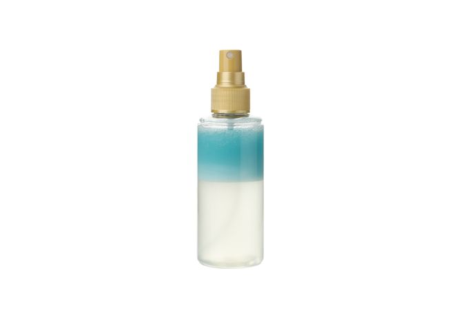 Blank bottle of cosmetic spray isolated on light background