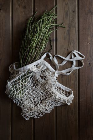 string bag with asparagus