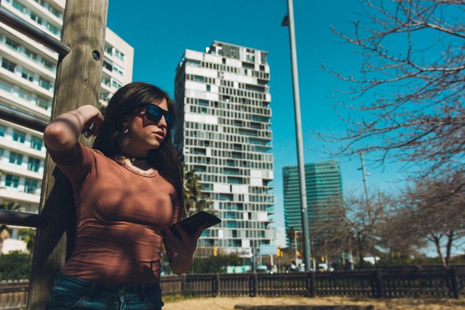 Teen girl looking at her smartphone.