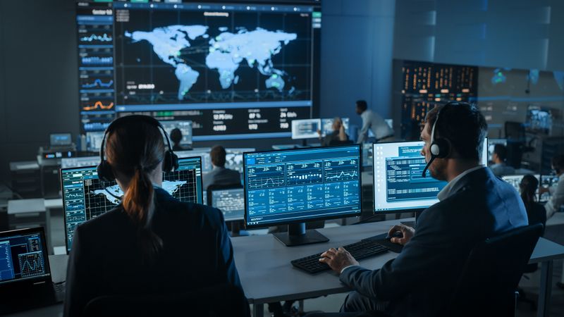 Cybersecurity Experts Monitor Global Network Activity in High-tech Operations Center.