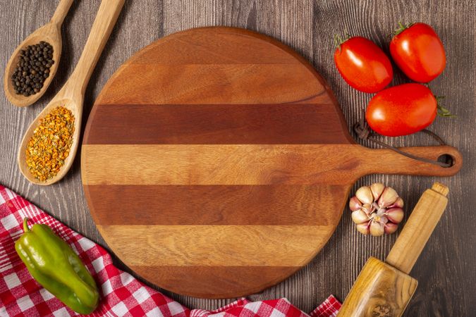 Wooden table with ingredients for pizza.