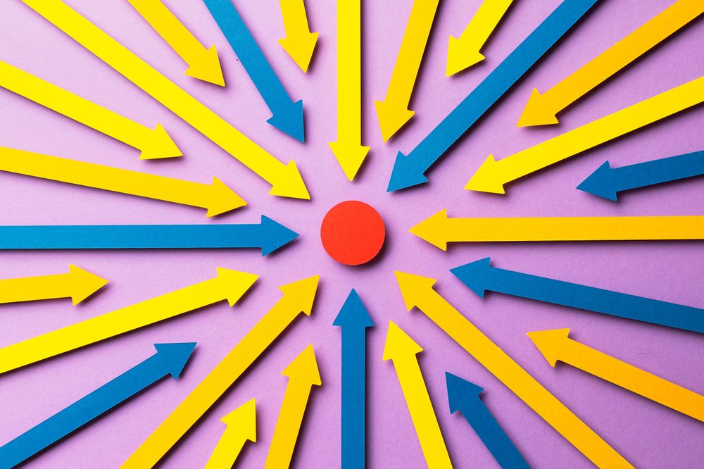 Paper arrows pointed at a red dot in the center