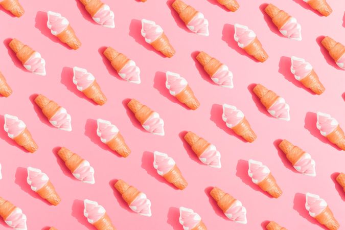 Ice cream in cones on pink background