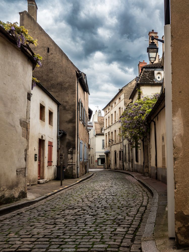 Empty streets of the medieval city of Beaune in Burgundy. The stormy sky