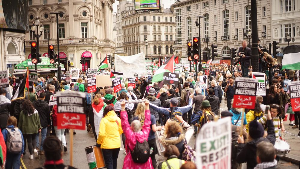 Back view of people at the demonstration for Palestine against Israeli aggression in London, UK