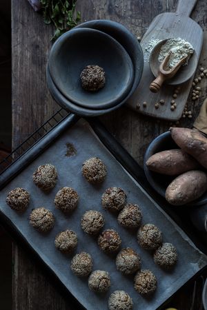 Set of sweet potatoes in sesame seeds on table