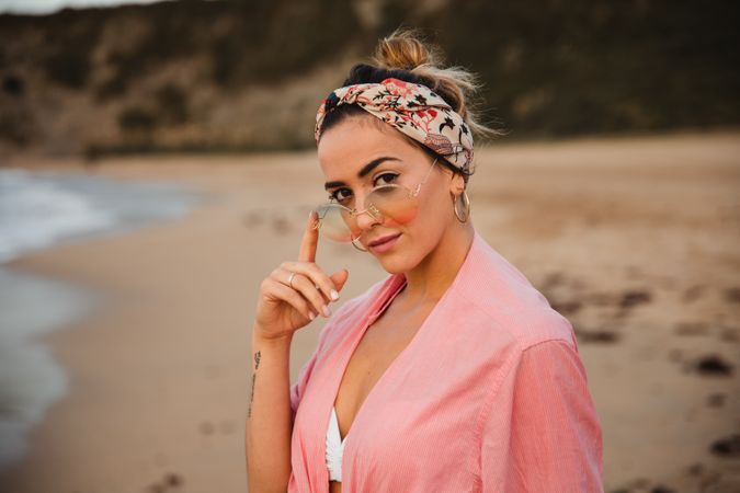 Stylish female resting on seashore