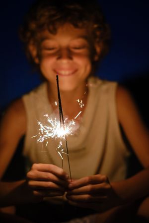 Delighted boy with Bengal lights