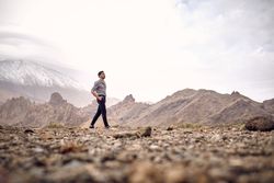 man walking in mountains