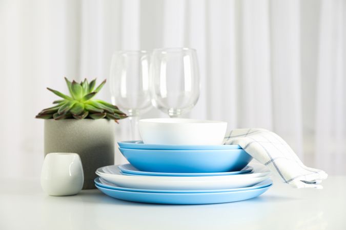Cutlery with succulent plant stacked on table, space for text