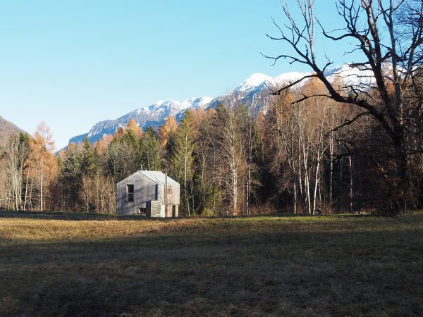 Alpine Solitude: Lone Cabin Amidst the Majestic Swiss Alps
