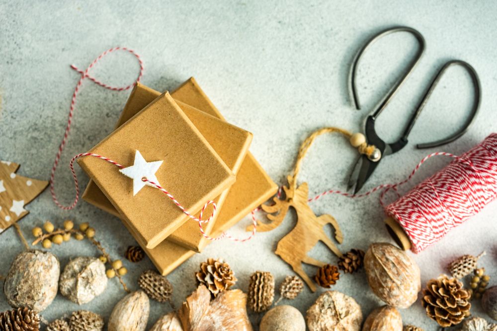 Holiday gift boxes with red string and scissors